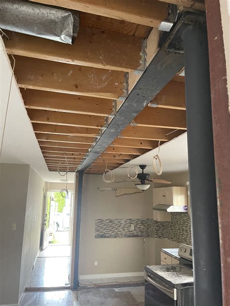 metal support beam for house|residential steel beam installation.